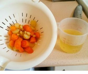 carrots and parsnips in strainers for baby food