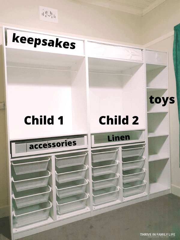 Shared kids closet with two IKEA PAX sections with 8 basket drawers each on bottom half and hanging poles in top half. Keepsake shelf on very top.